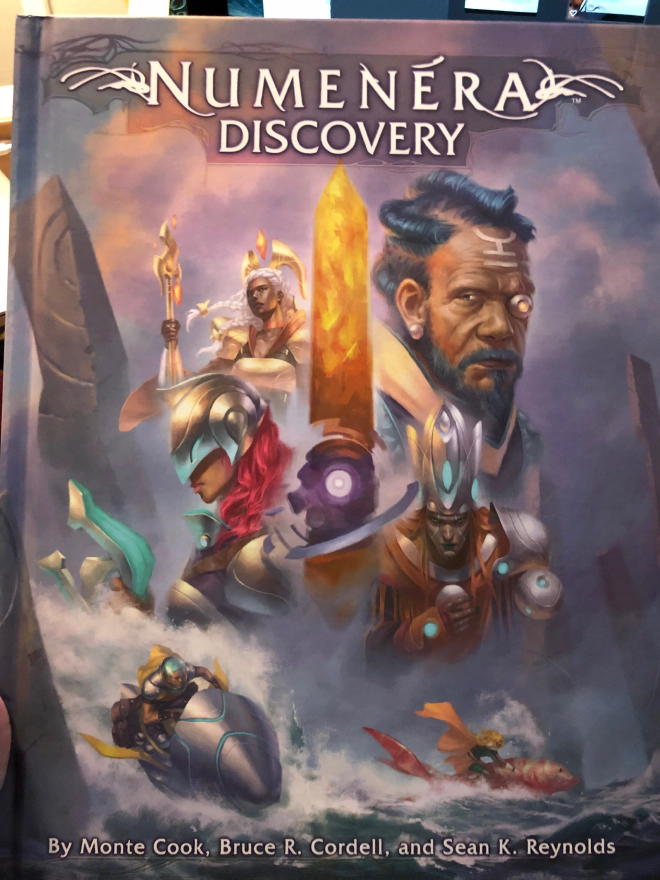 Cover of Numenera Discovery showing off science fantasy characters with a floating obelisk in the background.